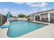 Private pool with basketball hoop adjacent to the home's patio at 4523 Oakglen Rd, Lakeland, FL 33813