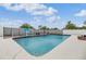 Sparkling private pool features diving area and lush landscaping at 4523 Oakglen Rd, Lakeland, FL 33813