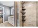 Walk-in shower with tiled walls and a rainfall shower head at 4523 Oakglen Rd, Lakeland, FL 33813