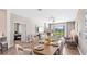 Elegant dining area with stylish furnishings and natural light flowing in through the sliding glass door at 4764 Waltham Forest Dr, Davenport, FL 33837