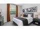 Serene bedroom featuring a neutral color palette, comfortable bedding, and modern artwork at 4779 Waltham Forest Dr, Davenport, FL 33837
