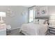 Bright bedroom featuring playful decor, a comfortable bed, and a soothing ambiance at 4779 Waltham Forest Dr, Davenport, FL 33837