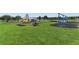 Community playground with swings, slides, and climbing equipment at 4779 Waltham Forest Dr, Davenport, FL 33837