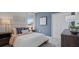 Inviting bedroom with plush carpeting, a comfortable bed, and soft, natural lighting at 466 Puma Loop, Groveland, FL 34736
