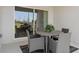 Outdoor patio with a dining table, chairs, and sliding glass doors leading to the interior at 466 Puma Loop, Groveland, FL 34736