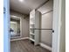 Walk in closet with laminate flooring and built in shelving unit at 620 San Pedro Dr, Lady Lake, FL 32159