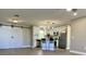 Bright kitchen featuring stainless steel appliances, an island with seating, and open to living area at 620 San Pedro Dr, Lady Lake, FL 32159