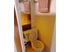 Cozy bathroom features a retro-yellow toilet, mirror, and hand towel at 109 Fern Dr, Debary, FL 32713