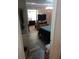View from the doorway of a bedroom with hardwood flooring, a TV, and a sitting area at 109 Fern Dr, Debary, FL 32713