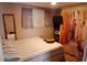 Cozy bedroom with striped bedding, window for natural light, and wall decor creating a relaxing space at 109 Fern Dr, Debary, FL 32713