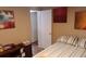 This bedroom features light-colored walls, art, and striped bedspread at 109 Fern Dr, Debary, FL 32713