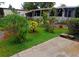 Well-maintained lawn and garden create a tranquil setting for this charming home exterior at 109 Fern Dr, Debary, FL 32713