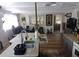 Bright open-concept home features a kitchen with island seating, adjacent to a comfortable living area at 109 Fern Dr, Debary, FL 32713