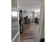 Open-concept living room view showcases modern flooring and flows seamlessly into the kitchen area at 109 Fern Dr, Debary, FL 32713