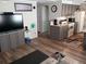 This living room offers an open floorplan, modern decor, and convenient access to kitchen amenities at 109 Fern Dr, Debary, FL 32713