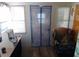 Small room with desk, chair, and door with a scenic screen at 109 Fern Dr, Debary, FL 32713