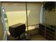 The patio has blinds, a grill, a shelving unit, and outdoor access at 109 Fern Dr, Debary, FL 32713