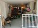 This patio area is equipped with a bar, seating, a putting green, and workout equipment at 109 Fern Dr, Debary, FL 32713