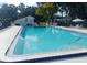 Sparkling community pool with clean, clear water, complete with poolside seating and a fenced perimeter at 109 Fern Dr, Debary, FL 32713