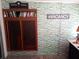 Room with built-in bookshelf and brick accent wall at 109 Fern Dr, Debary, FL 32713
