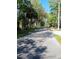 Scenic street view featuring mature trees and lush greenery, offering a peaceful neighborhood setting at 109 Fern Dr, Debary, FL 32713