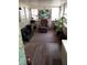 Cozy sunroom with seating, beach picture, and a tropical plant at 109 Fern Dr, Debary, FL 32713