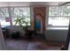 Bright sunroom with large windows, decorative art, and playful accents offering a relaxing space at 109 Fern Dr, Debary, FL 32713