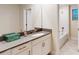 Clean bathroom featuring a vanity with gray countertop, a large mirror, and a bathtub/shower combination at 3225 Armstrong Ave, Clermont, FL 34714