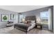 Serene main bedroom with plush bedding, soft lighting, and stylish accents at 3235 Armstrong Ave, Clermont, FL 34714