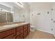 Bathroom featuring double sinks, tiled floors, and glass-enclosed shower at 1762 Regal River Cir, Ocoee, FL 34761