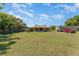 Expansive backyard with home, covered patio, and multiple vehicles visible at 4530 Old Road 37, Lakeland, FL 33813