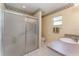 Clean bathroom featuring a glass-enclosed shower, a neutral color scheme, and a sink at 4530 Old Road 37, Lakeland, FL 33813