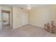 Bedroom showcasing a ceiling fan, neutral paint, plush carpeting, and a double-door closet at 4530 Old Road 37, Lakeland, FL 33813