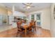 Charming dining area with wooden table, chairs, and access to the kitchen and outdoor views at 4530 Old Road 37, Lakeland, FL 33813