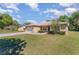 Well-kept one story home featuring manicured bushes, lush green grass, and an attached garage at 4530 Old Road 37, Lakeland, FL 33813