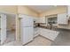 Functional kitchen with white cabinetry, tile flooring, and ample counter space at 4530 Old Road 37, Lakeland, FL 33813