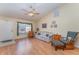 Cozy living room featuring vaulted ceilings, wood floors, and a comfortable seating area at 4530 Old Road 37, Lakeland, FL 33813