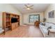 Inviting living room with wood-look flooring, a ceiling fan, and a view of the front yard at 4530 Old Road 37, Lakeland, FL 33813