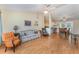 Open-concept living room flowing into the kitchen and dining area, showcasing wood floors at 4530 Old Road 37, Lakeland, FL 33813