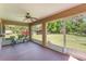 Covered patio with furniture looking out onto a spacious backyard at 4530 Old Road 37, Lakeland, FL 33813