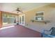 Covered patio featuring painted concrete floor and ceiling fan at 4530 Old Road 37, Lakeland, FL 33813