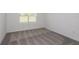 Empty bedroom with carpet and a window at 9056 Wildlight Trl, Wildwood, FL 34785