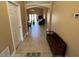 Open hallway with neutral tile flooring leading to living area at 1124 Liberty Hall Dr, Kissimmee, FL 34746