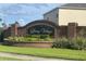 Liberty Village brick sign featuring a beautiful brick design with green landscaping at 1124 Liberty Hall Dr, Kissimmee, FL 34746