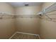 Walk-in closet with lots of wire shelving for clothing storage at 1124 Liberty Hall Dr, Kissimmee, FL 34746