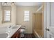 Functional bathroom with a double sink vanity and a shower-tub combination at 1203 Lake Miriam Dr, Lakeland, FL 33813