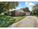 Charming single-story brick home with attached garage and well-manicured lawn at 1203 Lake Miriam Dr, Lakeland, FL 33813