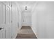 Bright hallway with wood-look floors leading to other rooms in the home at 1203 Lake Miriam Dr, Lakeland, FL 33813