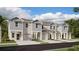 Charming new construction townhomes featuring a modern facade and attached garages at 2910 Savior Ave, Davenport, FL 33837