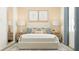 Serene main bedroom with neutral colors, plush bedding, and stylish nightstands at 4341 Curacao Pl, Kissimmee, FL 34758